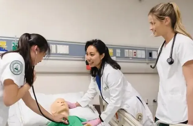 Nursing students with Doctor and patient